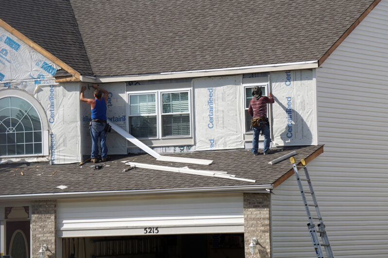 Roofers Protecting Wichita Home From Wind Damage Roofers Protecting Wichita Home From Wind Damage
