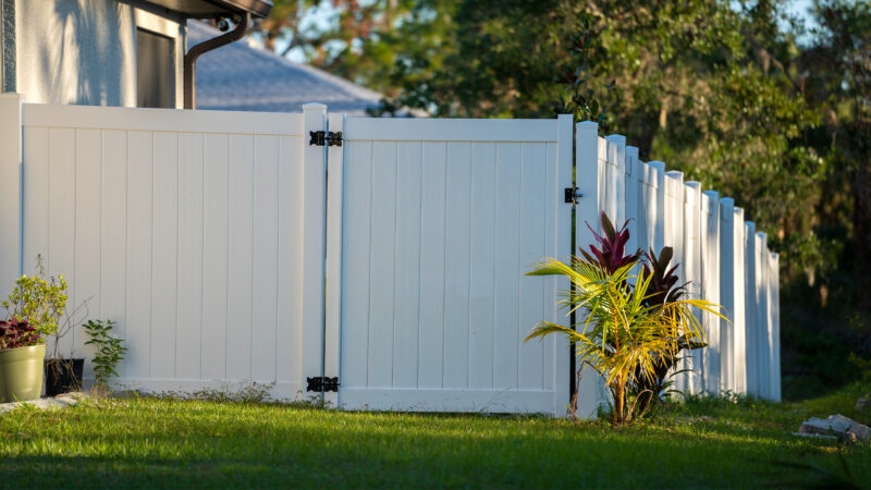Home With White Vinyl Fencing